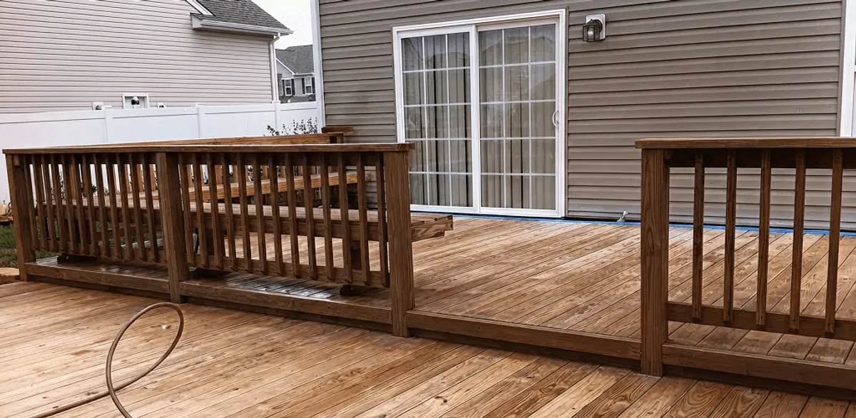 Deck sealing service protecting a backyard wood deck and railings in Pasadena, CA
